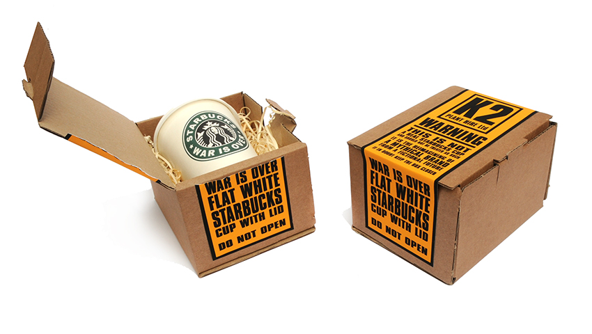 The JAMs 2023 War Is Over starbucks cup with packaging closed and open